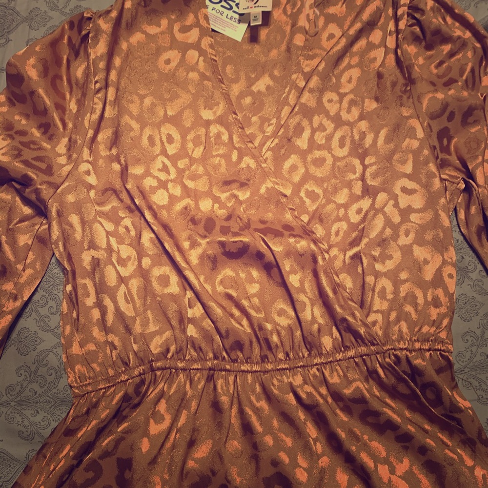 Beautiful gold blouse with the tags still on it.